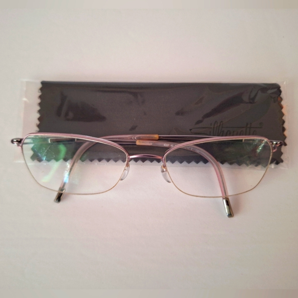 SILHOUETTE 4337 40 6053 52/17/135 MATTE PINK HALF RIMLESS EYEGLASSES FRAME.